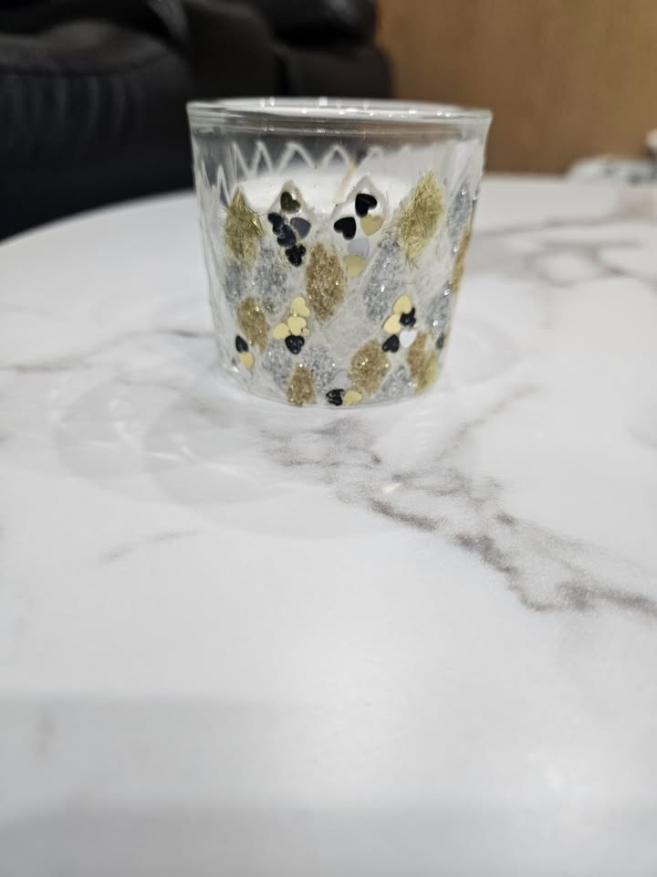 Hand decorated candle artwork by Vidhi Shah